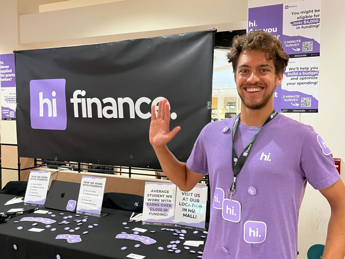 The hi finance team at a tabling booth on campus